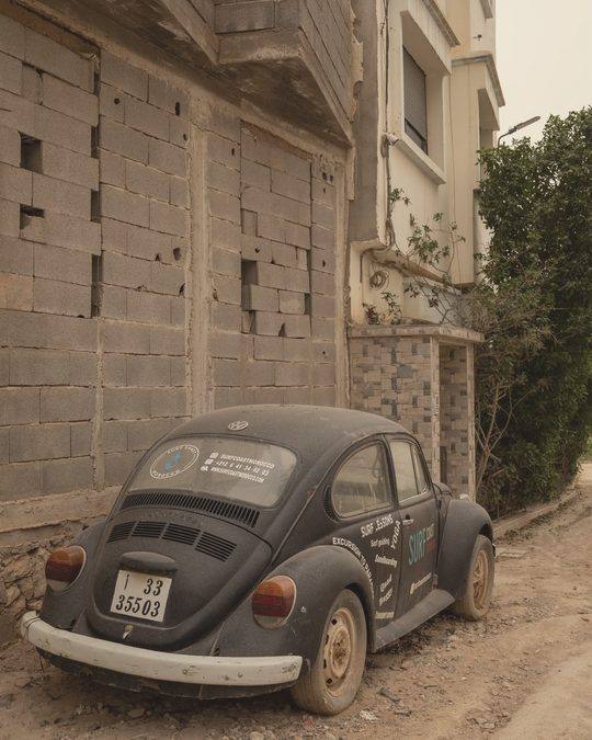 Vintage Beetle parked by a wall